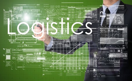 businessman writing Logistics and drawing some sketches